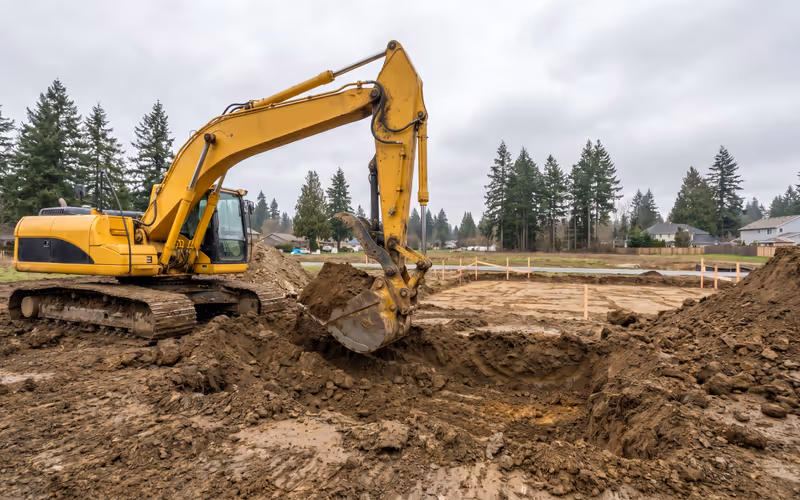 Excavator preparing a residential building lot in the Lower Mainland of British Columbia